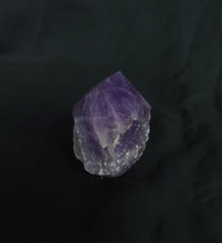 Load image into Gallery viewer, Purple crystal on a black background
